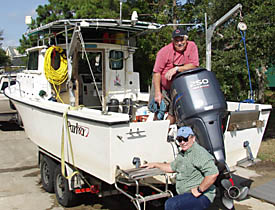 Volunteers Ralph Wilbanks and Darrell Taylor aboard <em>Diversity.