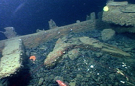The Mystery Collier is filled up to its main deck beams with coal.