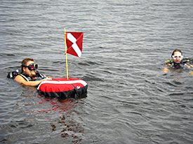 Jeremy and Nadine swim out towards the buoy marking a target for investigation.