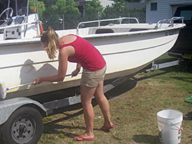 Nadine cleans off the skiff.