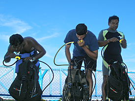 Members of Team 2 getting their equipment ready for the dive.