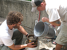 Matt Gifford and Chad Gulseth screening samples for plant remains.