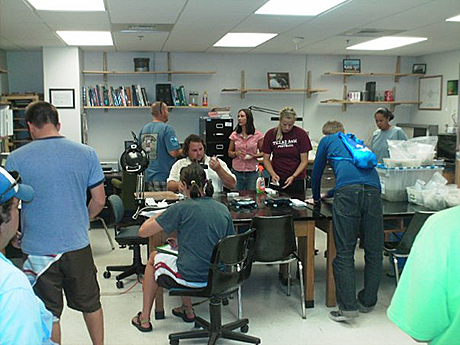 Students in the conservation lab processing artifacts.
