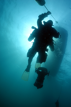 A view of a diver at a decompression stop taken from below.