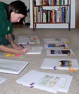Michelle takes notes on the printed copies of the woodblock prints.