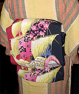 Obi with embroidered sailing vessel.