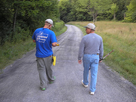 Walking with an informant to a previously unrecorded site.