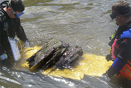 Dr. Stewart and Jeremy carefully transport the rudder assemblage to shore.