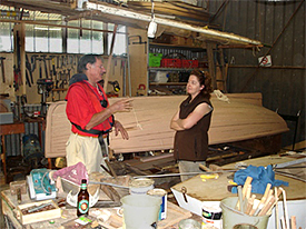 Armfield Chairman Rick explaining boat restoration to Kellie.