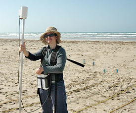 Najat stands ready for the magnetometer survey.