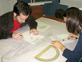 Mylar slates with grid lines are used to record construction details.