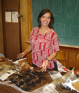 Michelle prepares several recovered fasteners for the conservation process.