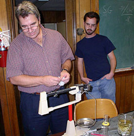 Dr. Rodgers and Adam test the specific gravity of a mystery material (it was magnesium).
