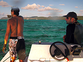 A local guide helps the team find submerged plane wreckage.