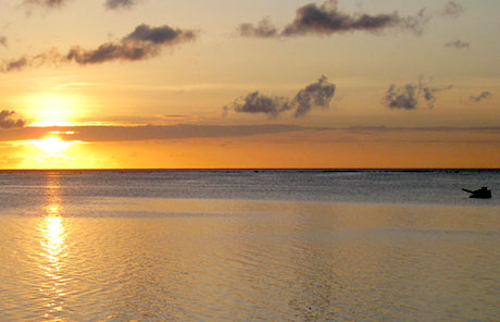 Local sunset over Garapan Lagoon, Sherman tank in the background.