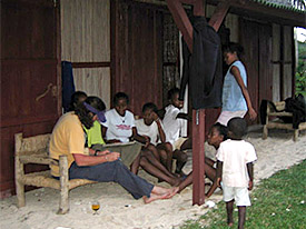Michael Krivor teaching local students English as they teach him Malagasy.