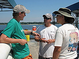 Team 3 discussing their dive plan on the UWF barge.