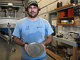 This intact plate was recovered Thursday lying against what could possibly be the windlass of the ship.