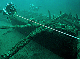 Diver measuring the Island City's centerboard trunk.